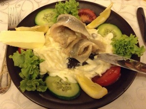 Only the first course, but a big plate of fish, sauce and salad