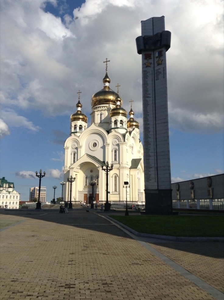 A large church, white with golden roundels