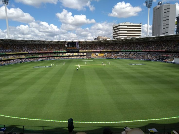 View of the pitch from the Gabba. Play in action, looking very far away.