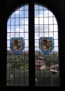 View through a window; centre is stained-glass with a horse