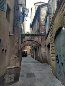 Consecutive archways on a narrow street