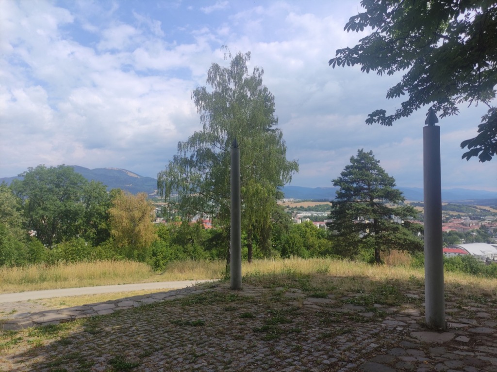 A view from the hills South of Banská Bystrica looking over town with the low Tatra mountains behind