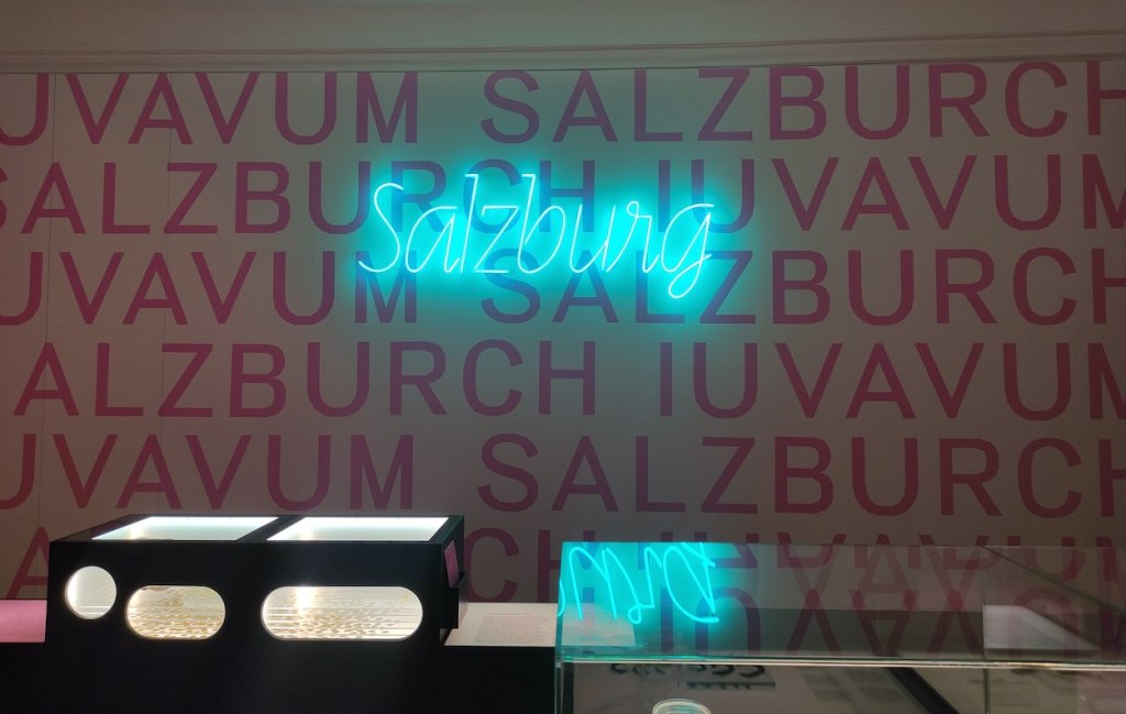 A neon sign in the museum says "Salzburg"